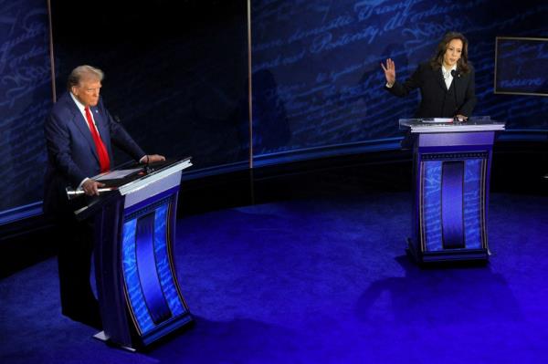 Democratic presidential nominee, U.S. Vice President Kamala Harris speaks during a presidential debate hosted by ABC as Republican presidential nominee, former U.S. President Donald Trump listens, in Philadelphia, Pennsylvania.