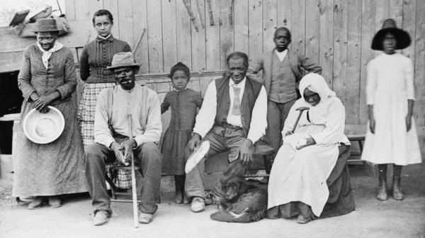 Tubman stands with extended family